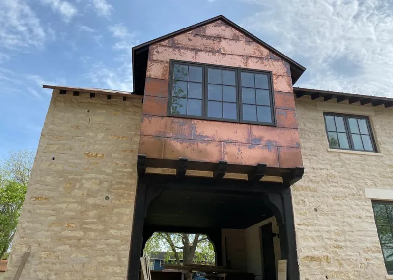 Copper metal panel facade on a stone building for Metal Roof Coating in Seffner
