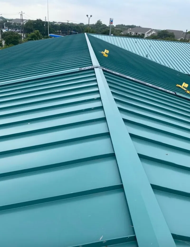 Green commercial metal roof ridge and valley for Metal Roof Repair in Seffner